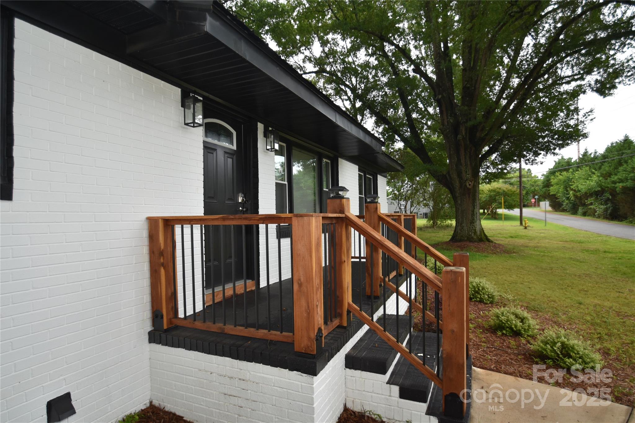 706 McIntyre Street Monroe, NC 28110 - Photo 3 of 20 a view of a balcony with an outdoor space