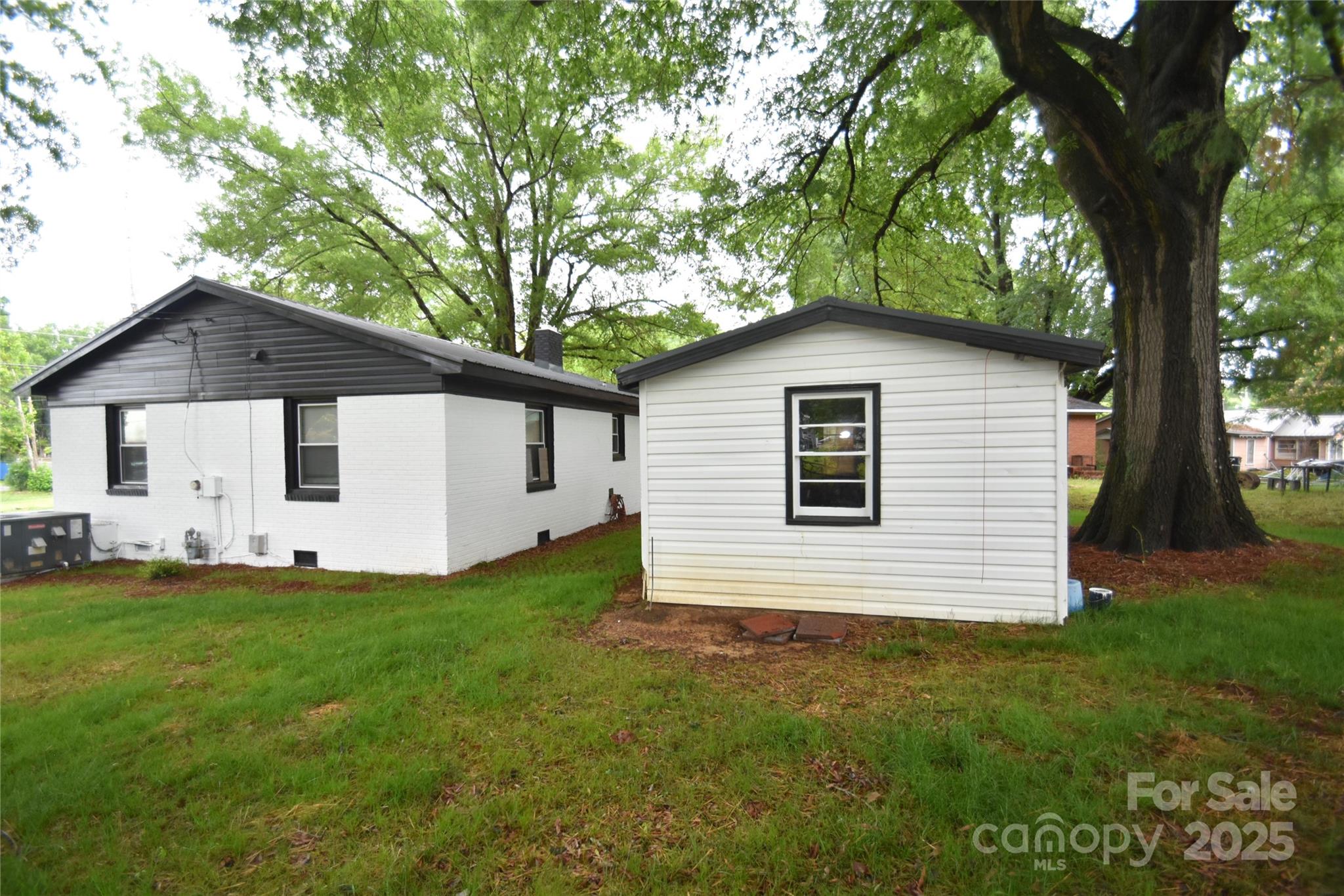 706 McIntyre Street Monroe, NC 28110 - Photo 7 of 20 a front view of a house with a yard