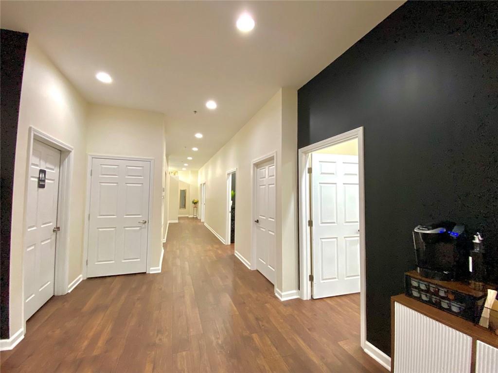 3636 Highlands Parkway Southeast, Unit 4 Smyrna, GA 30082 - Photo 13 of 32 a view of a hallway with wooden floor and a cabinet