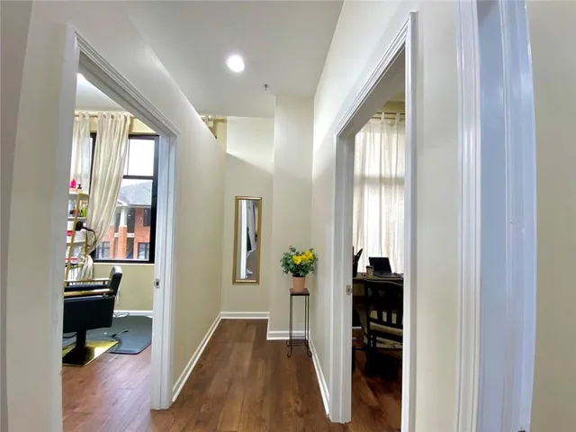 wooden floor in an empty room and a window