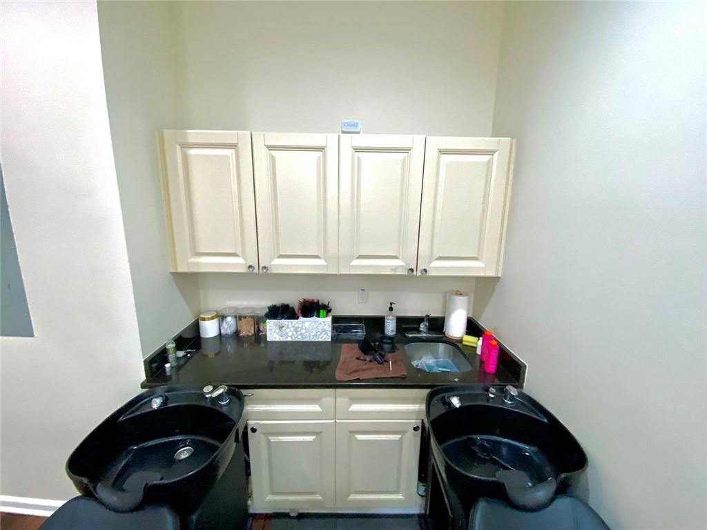 3636 Highlands Parkway Southeast, Unit 4 Smyrna, GA 30082 - Photo 21 of 32 a kitchen with a sink a stove and cabinets