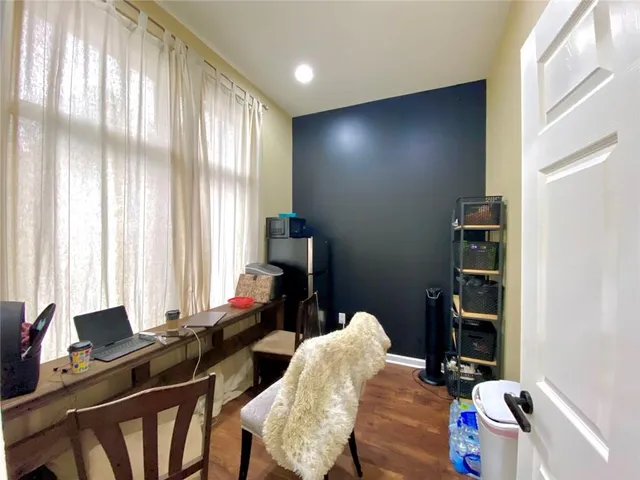 a bedroom with two beds and a window