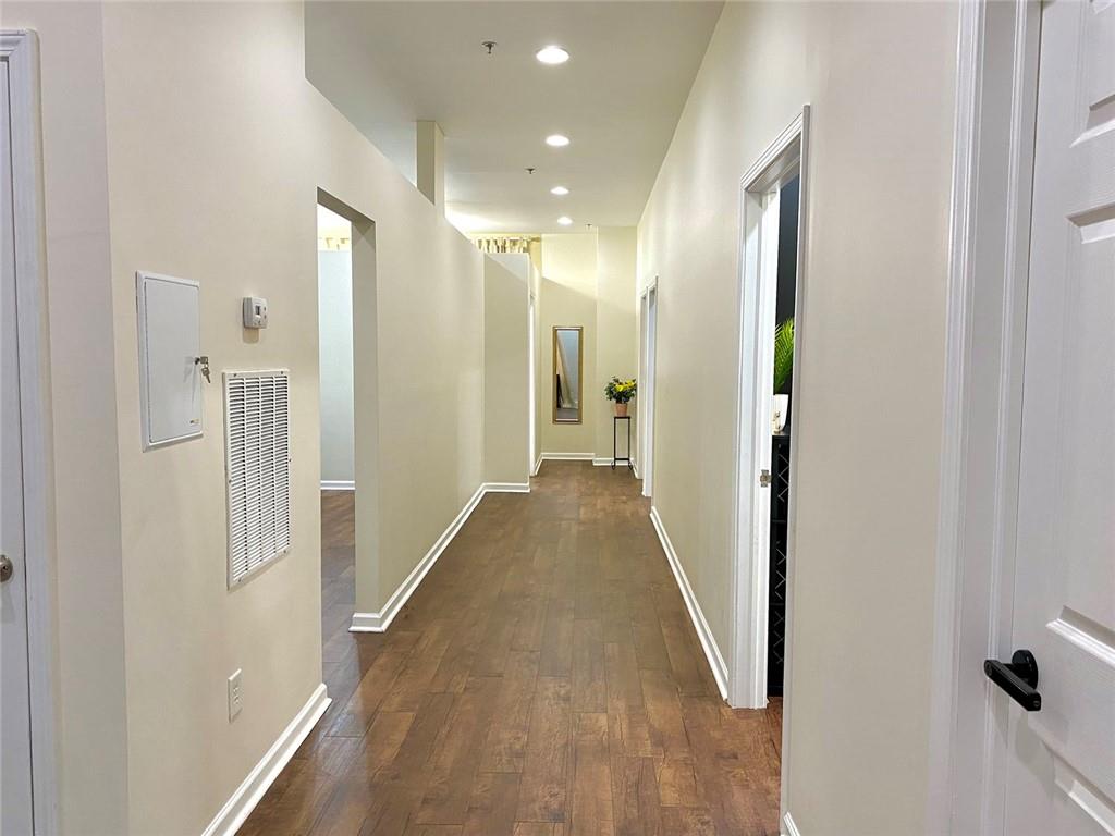 3636 Highlands Parkway Southeast, Unit 4 Smyrna, GA 30082 - Photo 27 of 32 a view of a hallway with wooden floor