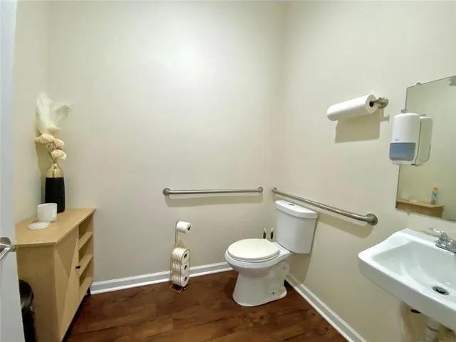 a bathroom with a toilet and a sink