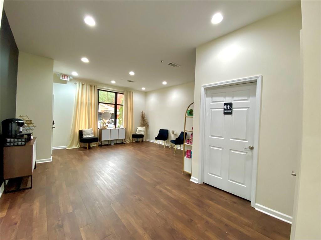 3636 Highlands Parkway Southeast, Unit 4 Smyrna, GA 30082 - Photo 5 of 32 a view of a livingroom with a furniture and wooden floor