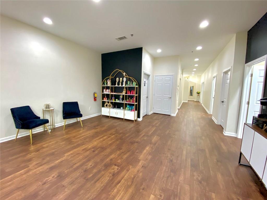 3636 Highlands Parkway Southeast, Unit 4 Smyrna, GA 30082 - Photo 8 of 32 a view of a room with gym equipment and wooden floor