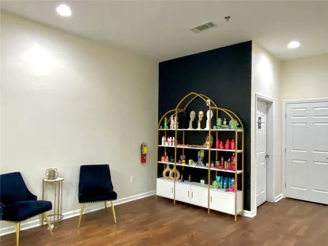 a view of a workspace with furniture