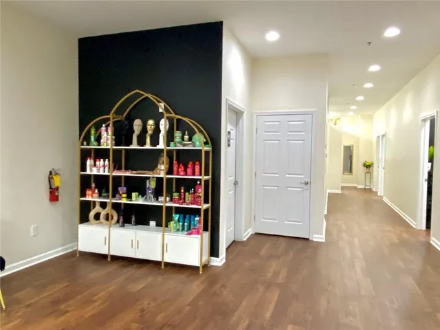 a view of empty room with wooden floor and closet