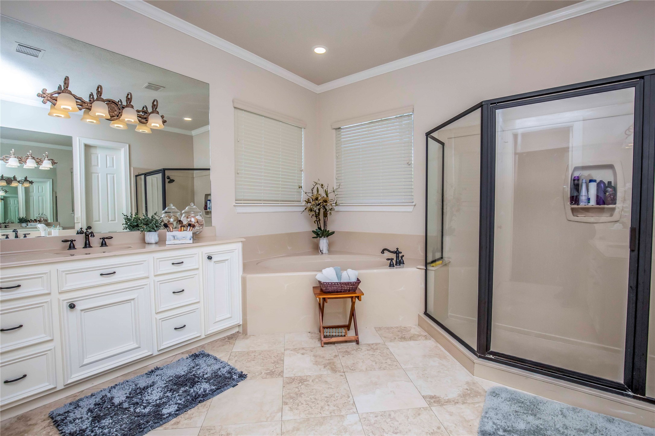 25219 Hideaway Run Drive Spring, TX 77389 - Photo 31 of 45 a spacious bathroom with a double vanity sink and a mirror