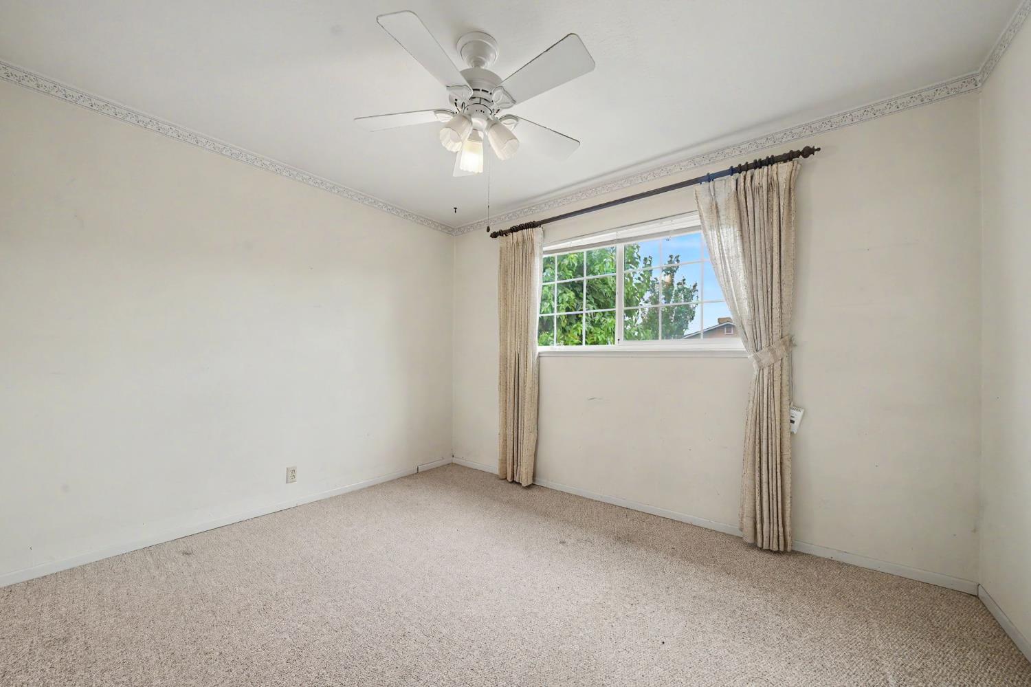 626 Sutter Lane Ione, CA 95640 - Photo 15 of 21 an empty room with a window