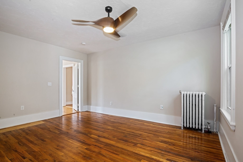 35 Oak Avenue, Unit 2 Worcester, MA 01605 - Photo 11 of 22 an empty room with wooden floor and windows