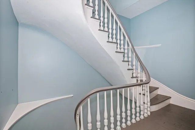 a view of entryway with wooden floor