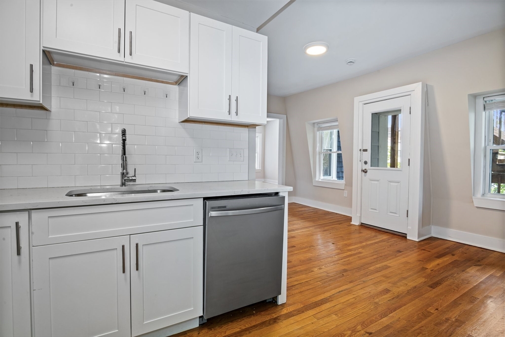 35 Oak Avenue, Unit 2 Worcester, MA 01605 - Photo 6 of 22 a kitchen with white cabinets and sink