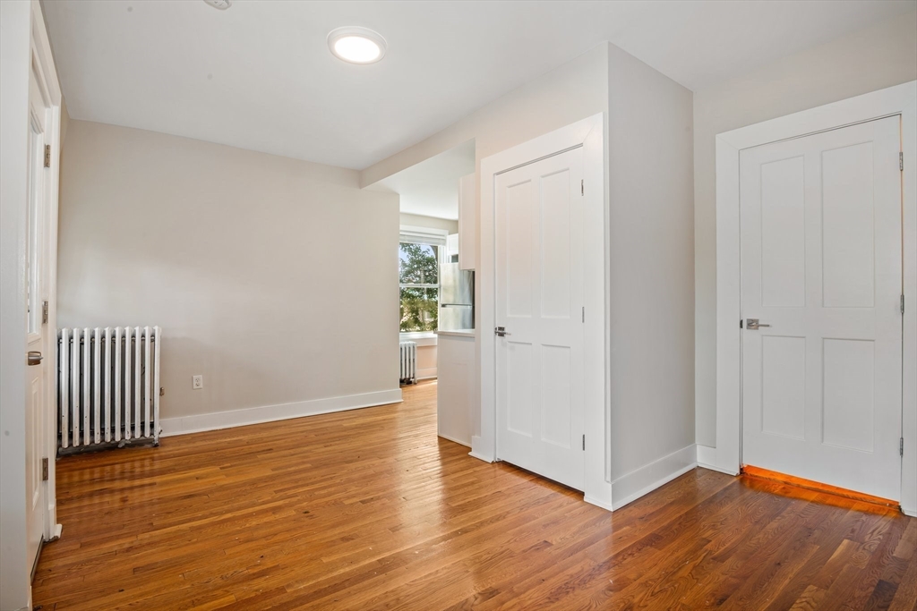 35 Oak Avenue, Unit 2 Worcester, MA 01605 - Photo 9 of 22 wooden floor in an empty room with a window