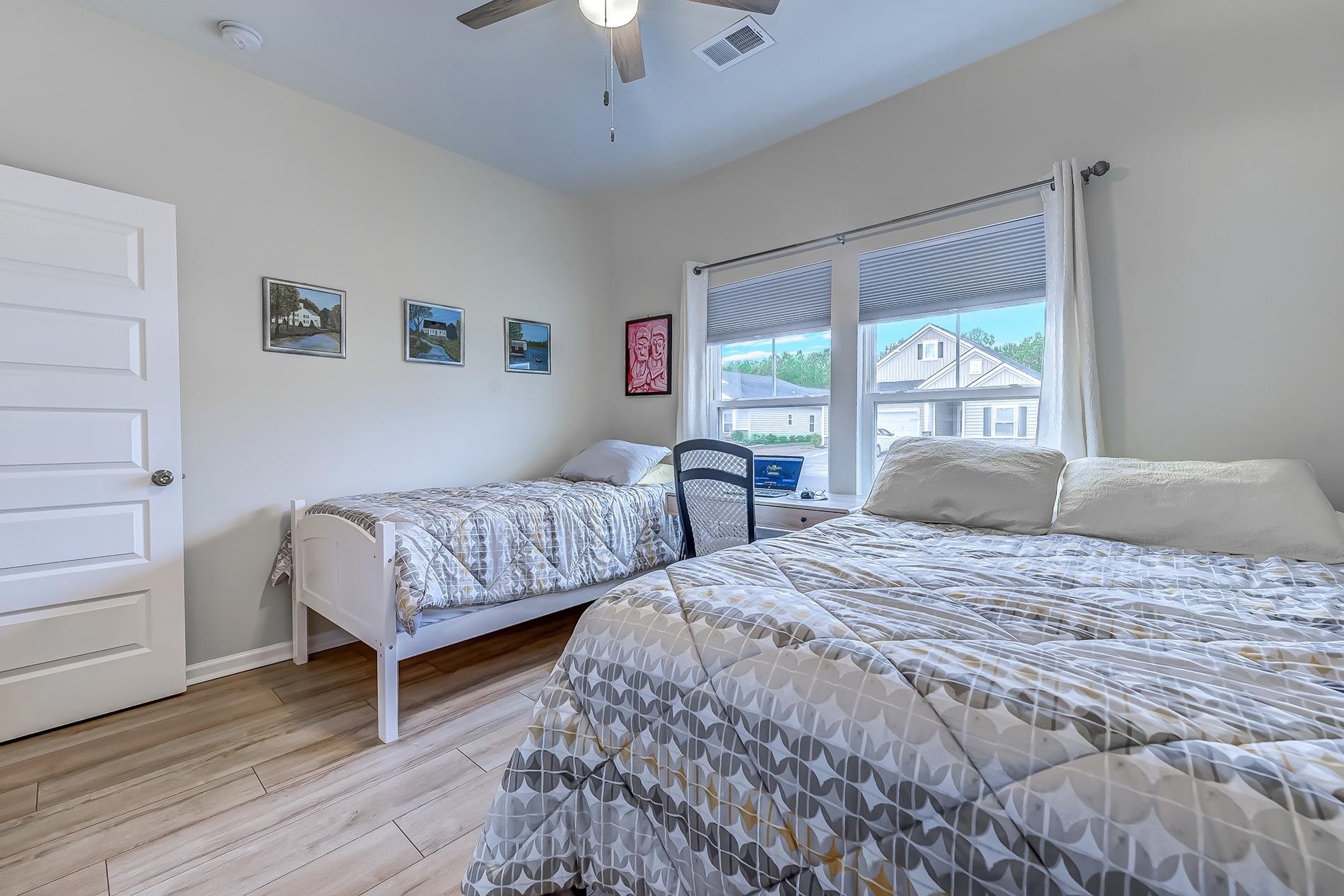 3016 Sistine Street Myrtle Beach, SC 29579 - Photo 12 of 39 Bedroom with light wood finished floors and a ceiling fan
