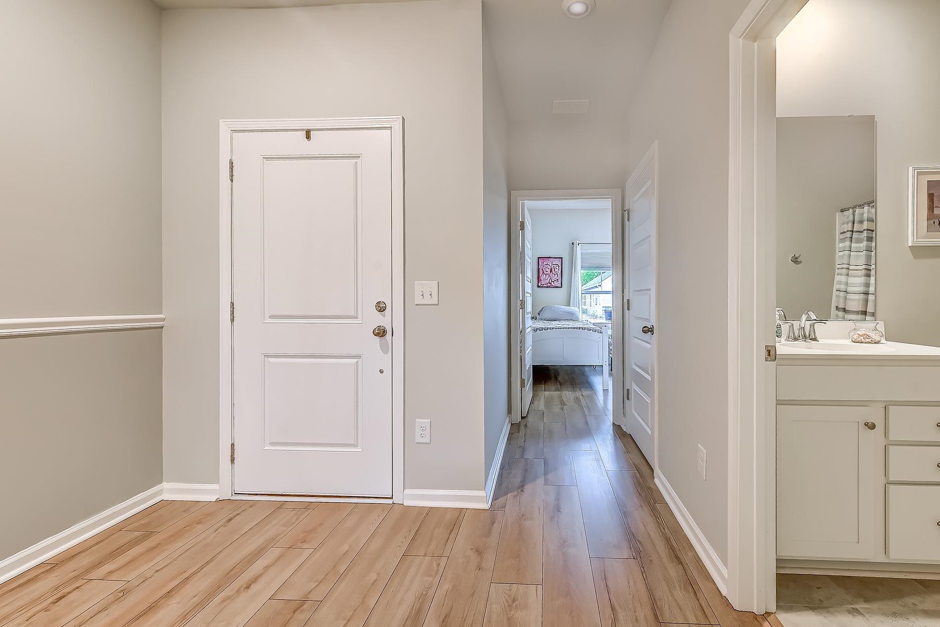 3016 Sistine Street Myrtle Beach, SC 29579 - Photo 9 of 39 Hallway with light wood finished floors and baseboards