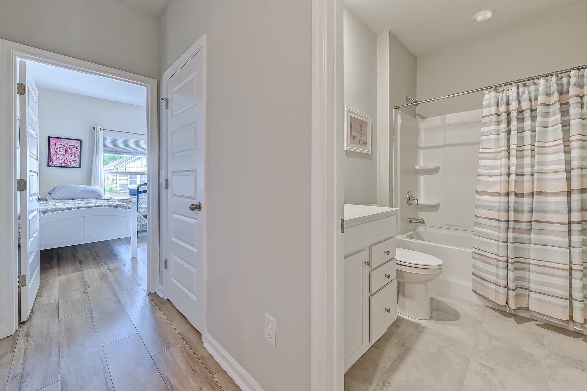 3016 Sistine Street Myrtle Beach, SC 29579 - Photo 10 of 39 Full bathroom featuring shower / bath combo with shower curtain, vanity, and ensuite bathroom