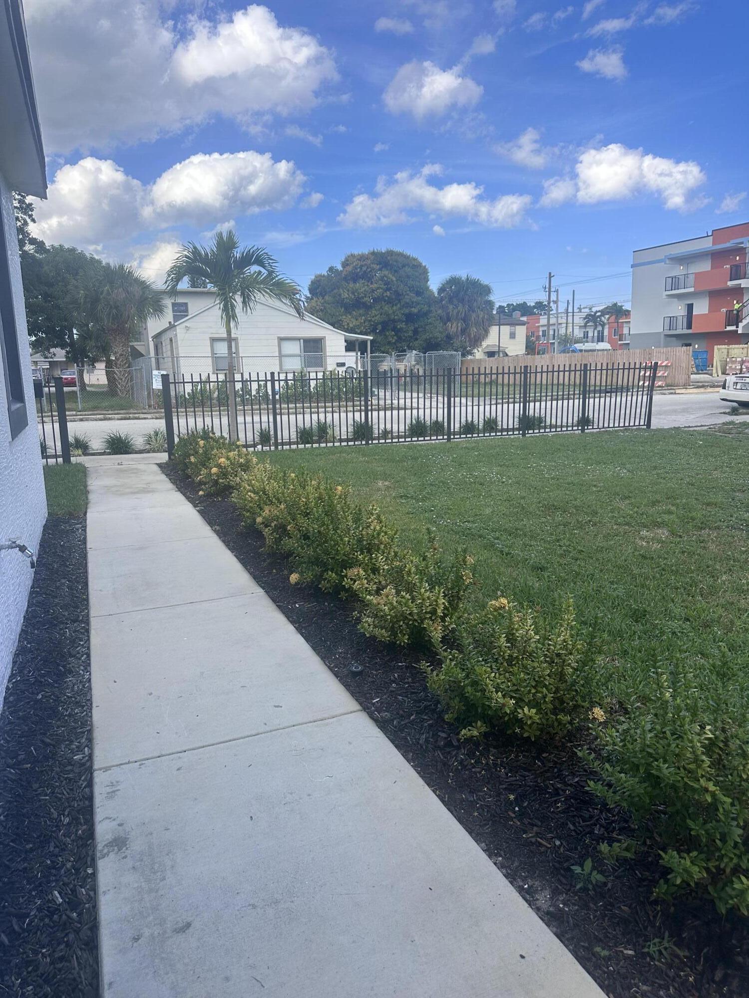 1016 State Street, Unit 12 West Palm Beach, FL 33407 - Photo 12 of 13 a view of a pathway with a garden
