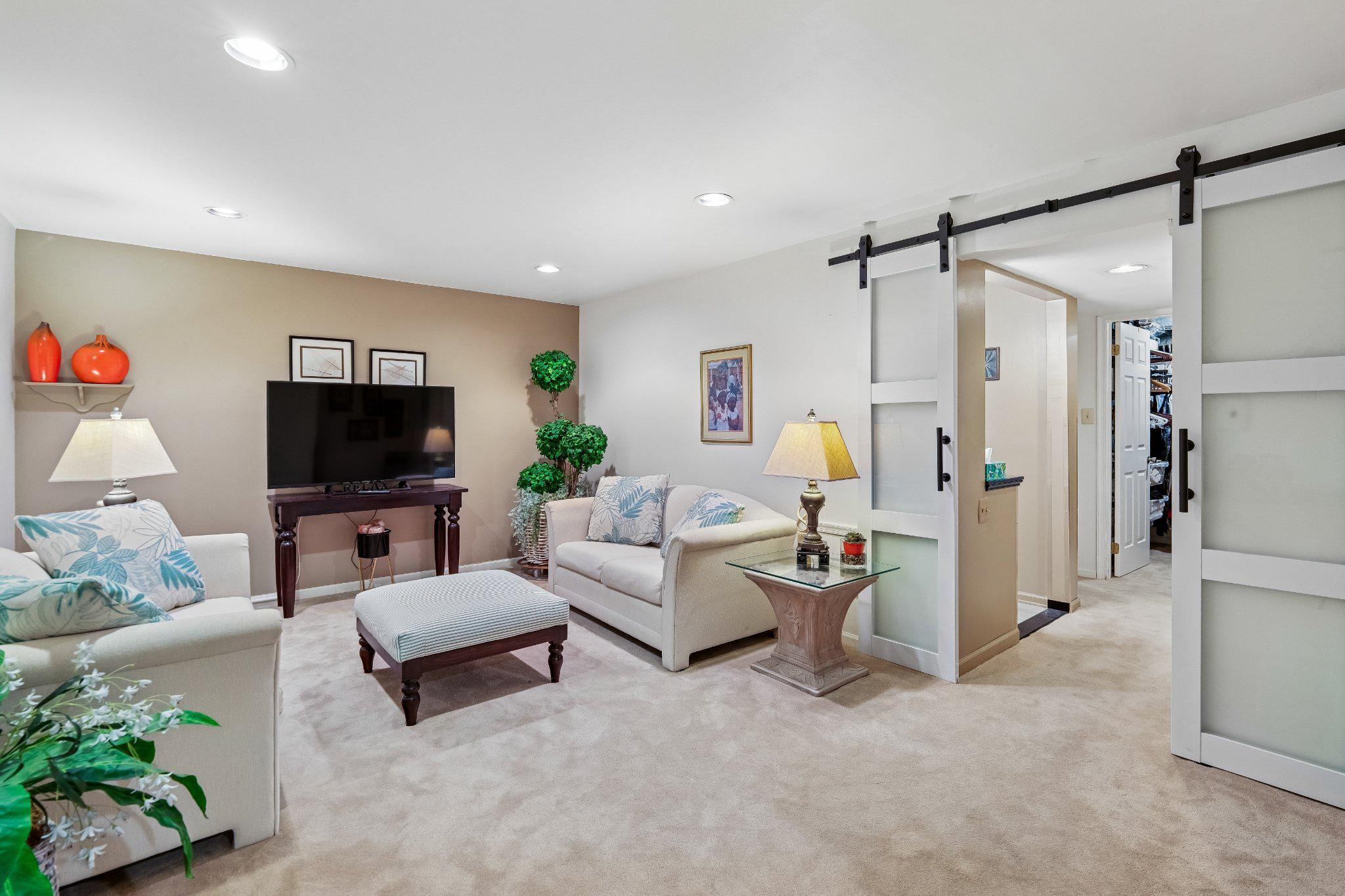 9505 Bald Hill Road Mitchellville, MD 20721 - Photo 33 of 39 Cozy lower level living space with modern charm.