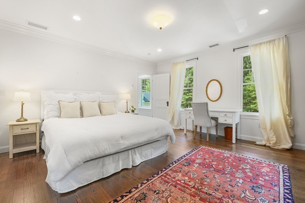 111 Lake Street Sherborn, MA 01770 - Photo 24 of 41 a bedroom with a large bed and a window