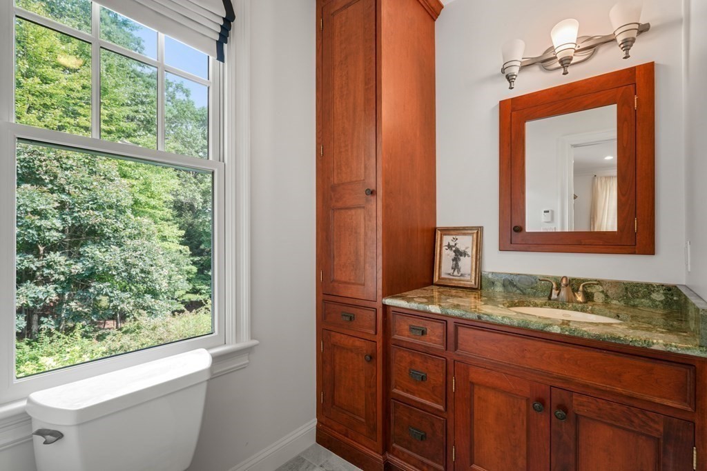 111 Lake Street Sherborn, MA 01770 - Photo 25 of 41 a bathroom with a granite countertop sink and a mirror