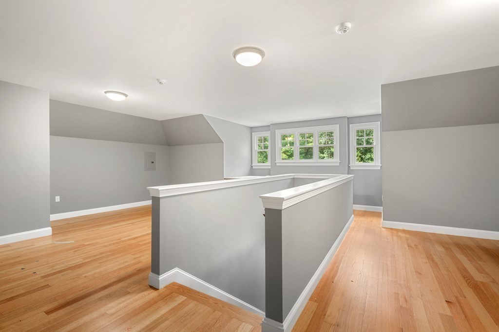 111 Lake Street Sherborn, MA 01770 - Photo 26 of 41 a view of hallway with window and wooden floor