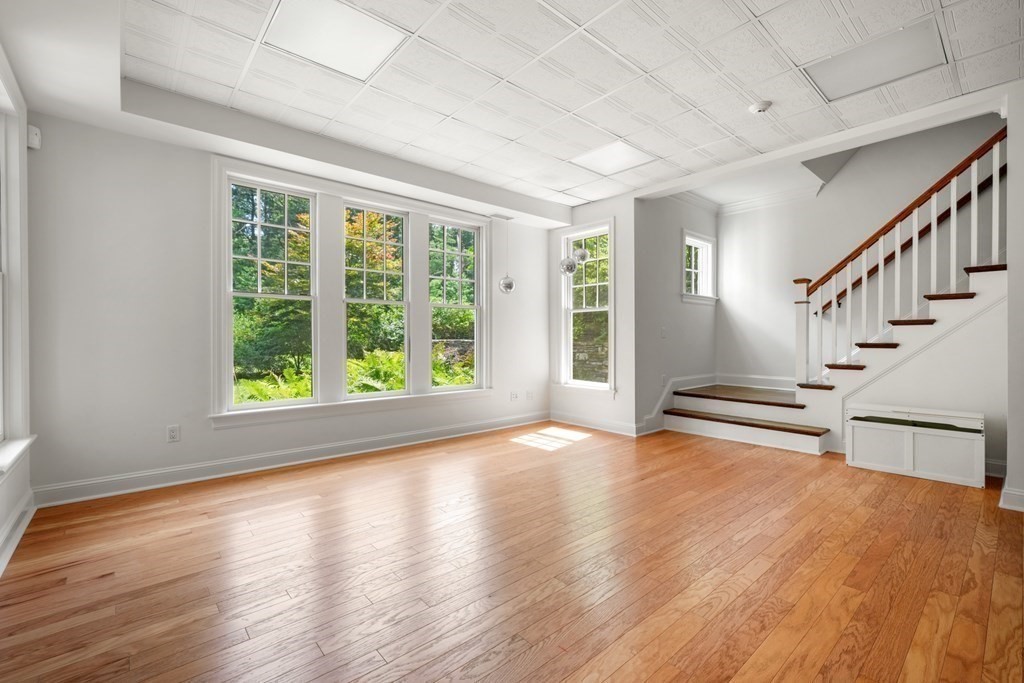 111 Lake Street Sherborn, MA 01770 - Photo 27 of 41 a view of an empty room with wooden floor and a window