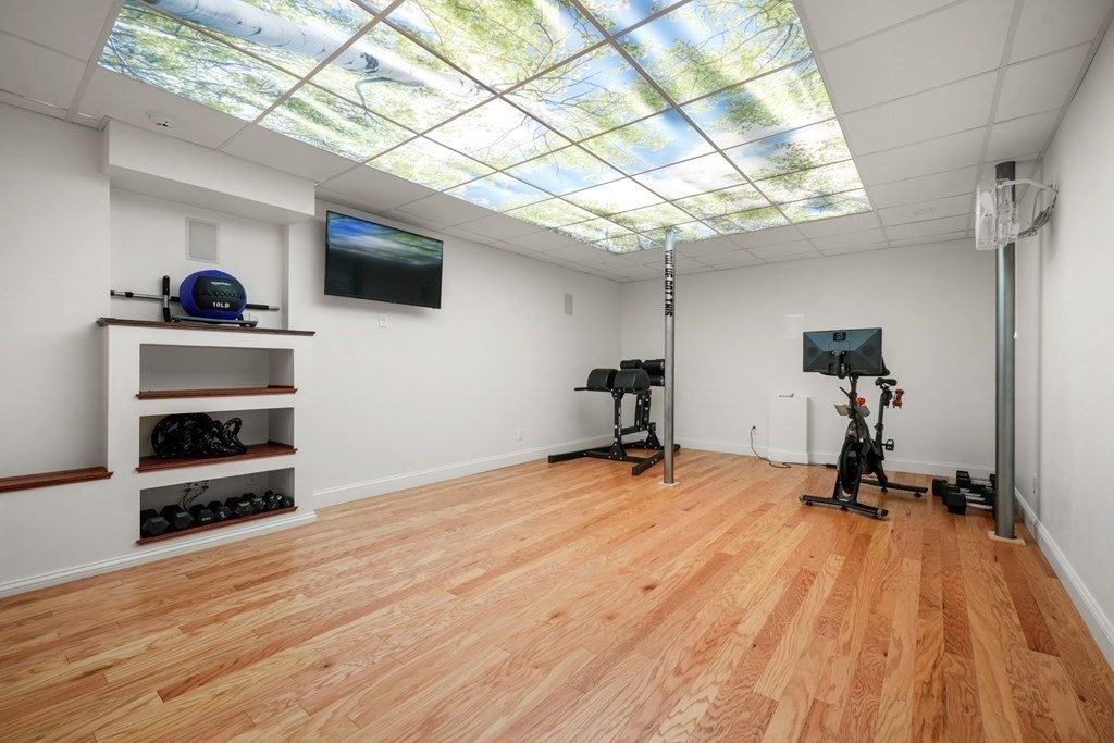111 Lake Street Sherborn, MA 01770 - Photo 29 of 41 a room with gym equipment and a rug