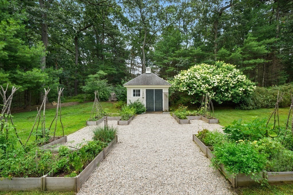 111 Lake Street Sherborn, MA 01770 - Photo 37 of 41 a front view of a house with garden