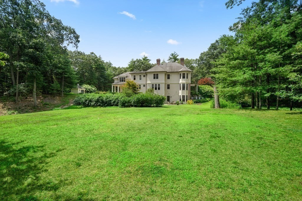 111 Lake Street Sherborn, MA 01770 - Photo 40 of 41 a view of a house with a big yard and large trees
