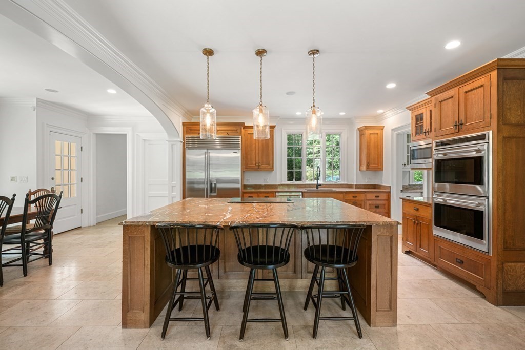 111 Lake Street Sherborn, MA 01770 - Photo 8 of 41 a dining table with chairs and kitchen view