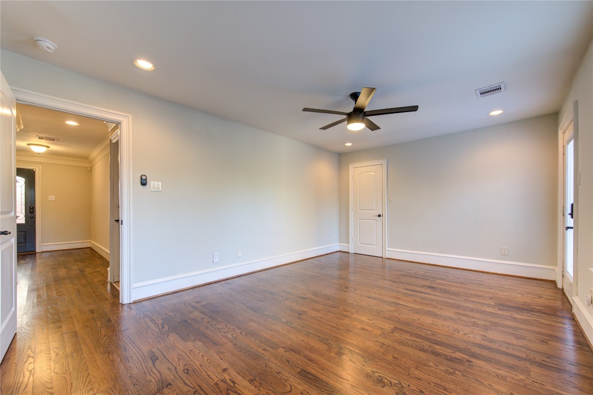 5226 Kiam Street, Unit 1015 Houston, TX 77007 - Photo 14 of 49 a view of an empty room with wooden floor