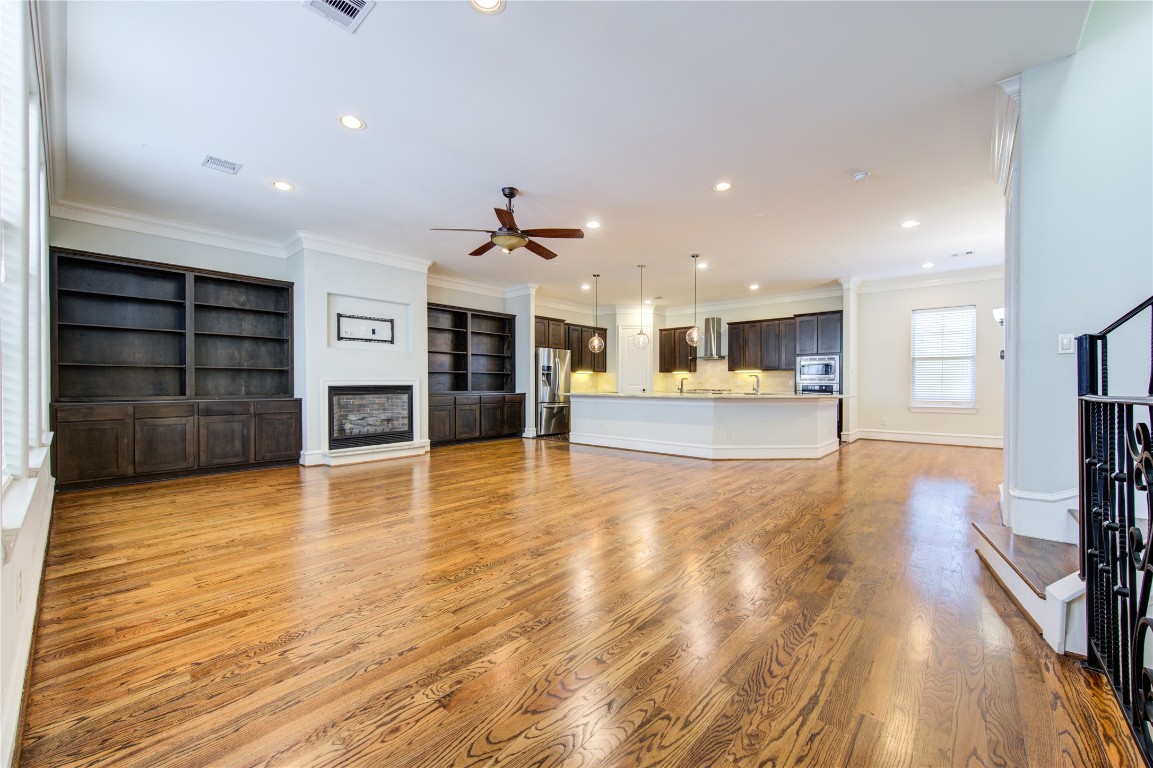 5226 Kiam Street, Unit 1015 Houston, TX 77007 - Photo 17 of 49 a view of a living room with furniture and wooden floor