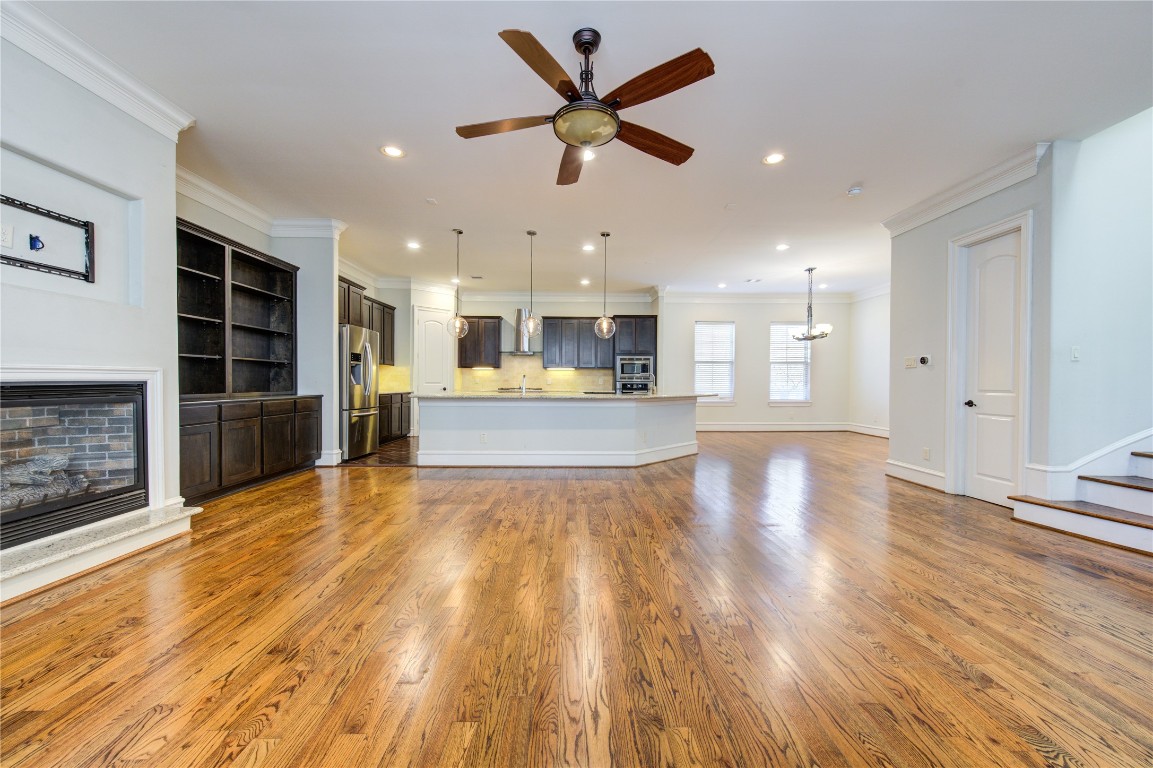 5226 Kiam Street, Unit 1015 Houston, TX 77007 - Photo 20 of 49 a view of kitchen with cabinets and wooden floor