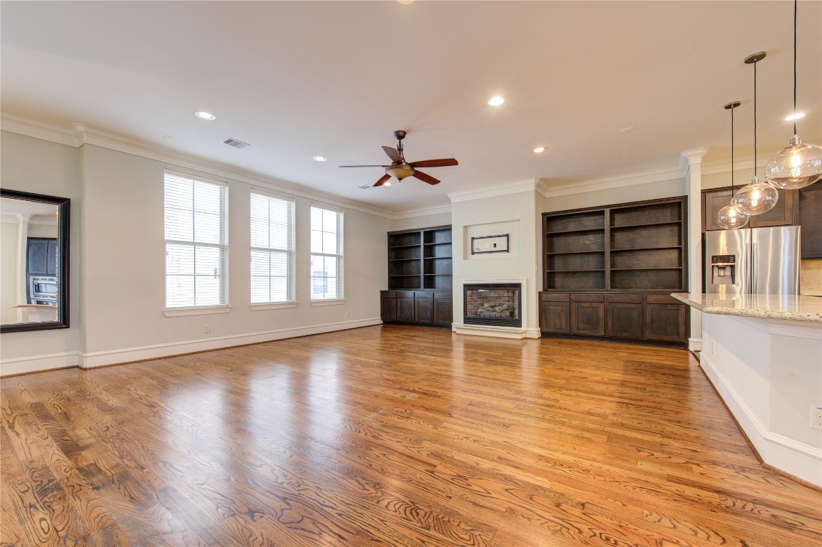 5226 Kiam Street, Unit 1015 Houston, TX 77007 - Photo 22 of 49 a view of a living room with wooden floor and a window