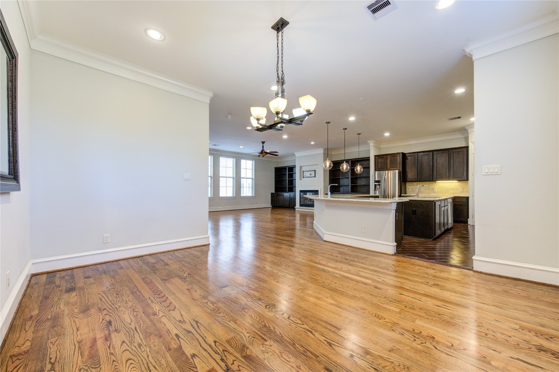 5226 Kiam Street, Unit 1015 Houston, TX 77007 - Photo 25 of 49 a view of a room with wooden floor and kitchen view