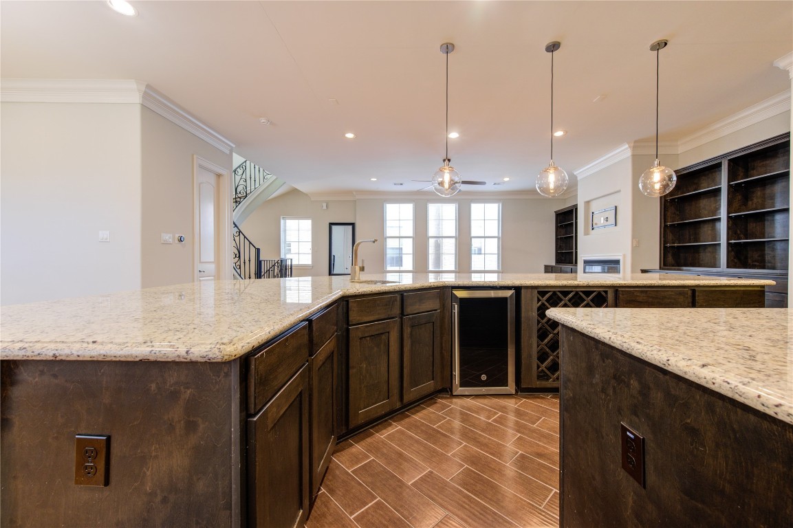 5226 Kiam Street, Unit 1015 Houston, TX 77007 - Photo 31 of 49 a kitchen with stainless steel appliances granite countertop a sink a stove and a wooden floor