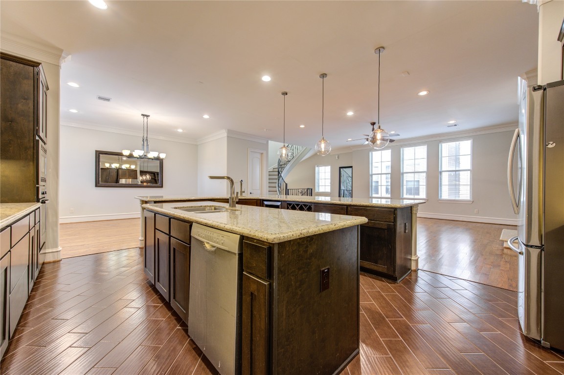 5226 Kiam Street, Unit 1015 Houston, TX 77007 - Photo 32 of 49 a kitchen with a stove and a wooden floor