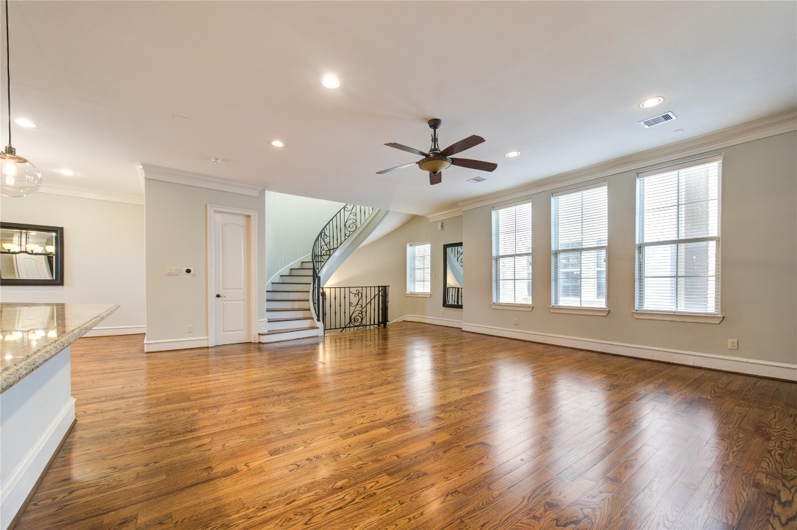 5226 Kiam Street, Unit 1015 Houston, TX 77007 - Photo 35 of 49 a view of empty room with wooden floor and fan