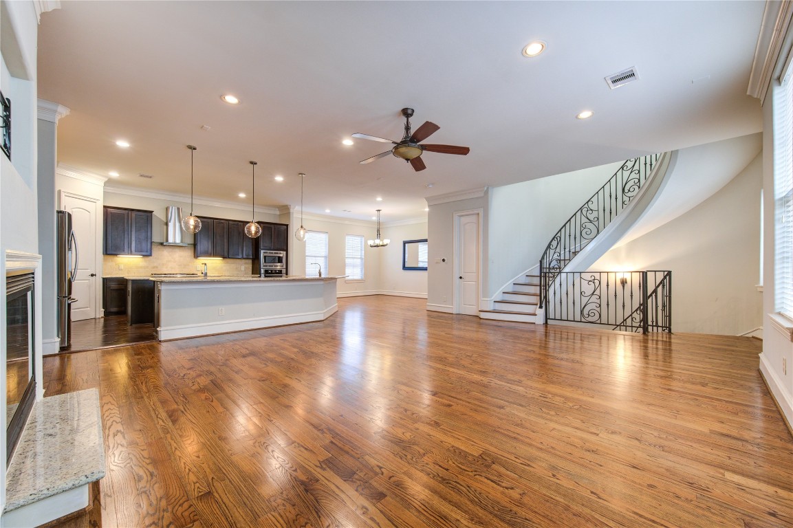 5226 Kiam Street, Unit 1015 Houston, TX 77007 - Photo 36 of 49 a view of a kitchen with furniture and a wooden floor