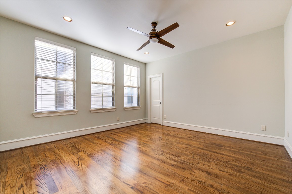 5226 Kiam Street, Unit 1015 Houston, TX 77007 - Photo 38 of 49 wooden floor in an empty room with a window