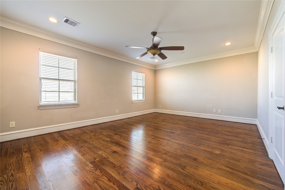 5226 Kiam Street, Unit 1015 Houston, TX 77007 - Photo 42 of 49 a view of an empty room with wooden floor and a window
