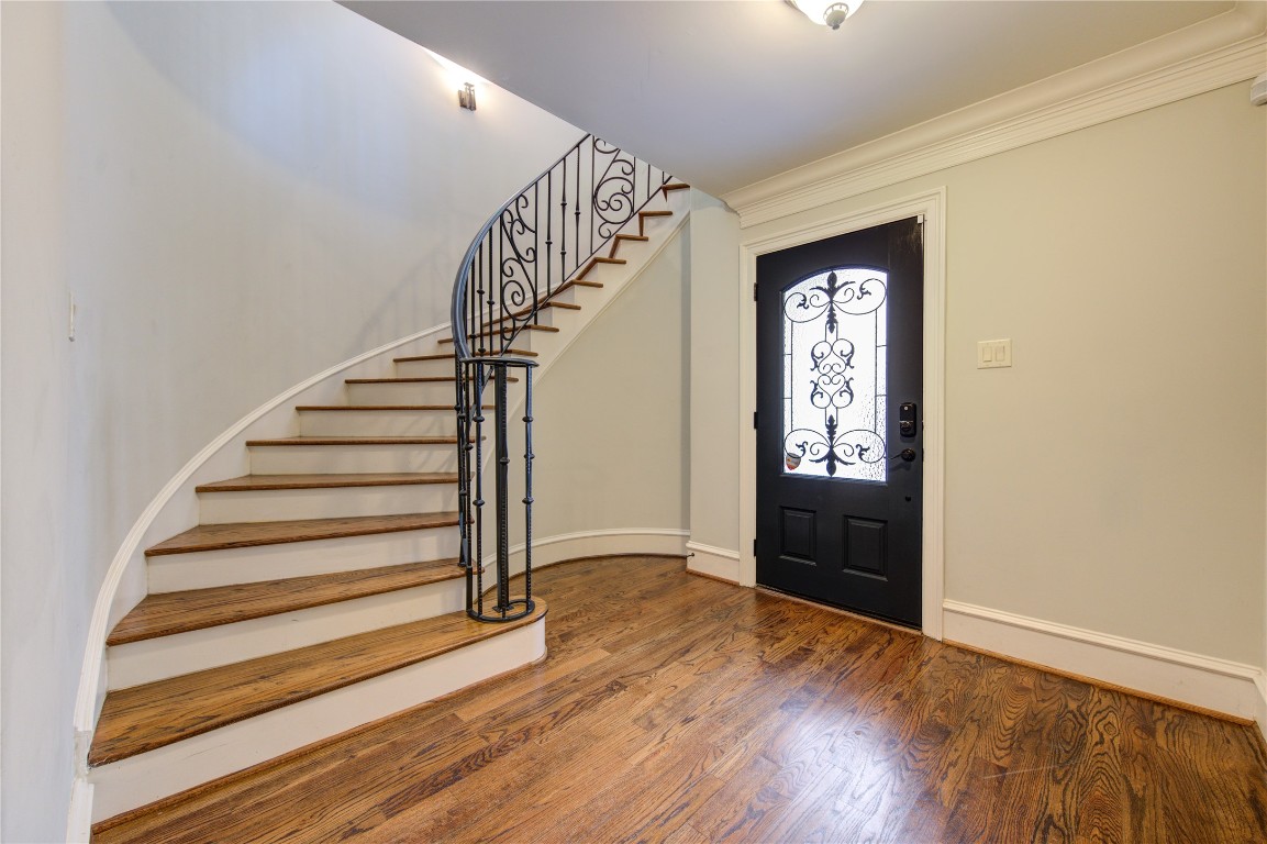 5226 Kiam Street, Unit 1015 Houston, TX 77007 - Photo 7 of 49 a view of entryway with wooden floor and stairs