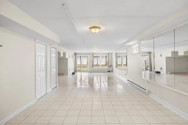 a view of an entryway with wooden floor
