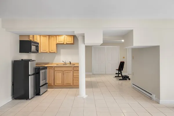 a kitchen with a sink cabinets and appliances
