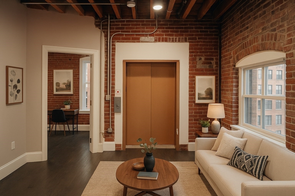281 Franklin Street, Unit 301 Boston, MA 02110 - Photo 1 of 7 a living room with furniture and a large window