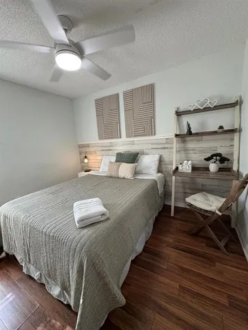 a bedroom with bed and window