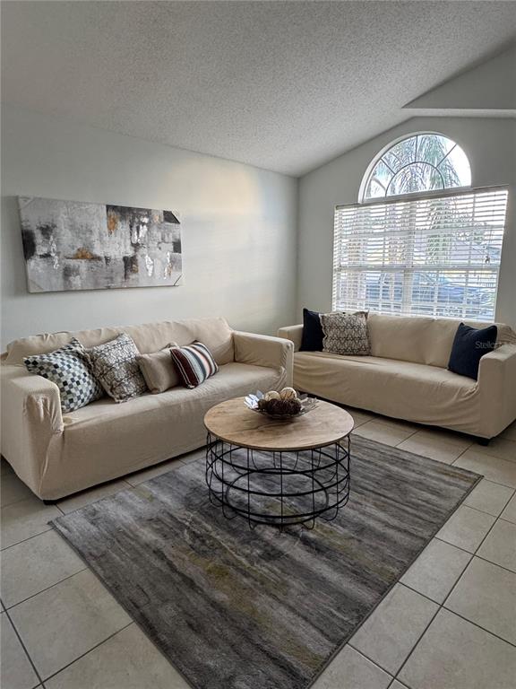2512 Asbury Court Kissimmee, FL 34746 - Photo 8 of 12 a living room with furniture and a large window