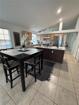 a dining room with a table and chairs