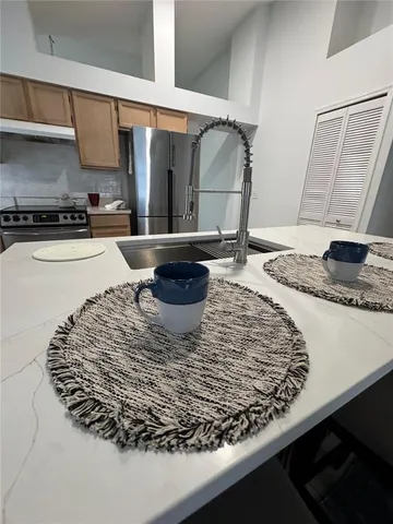 a kitchen with a stove and a sink